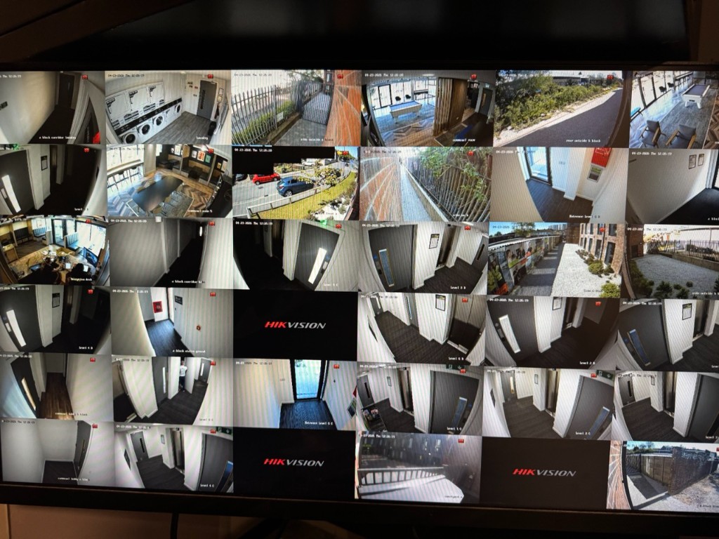 Hikvision IP CCTV monitoring across corridors, laundry, and common areas