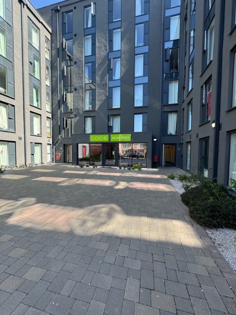 Code Harper Road courtyard and sales office entrance