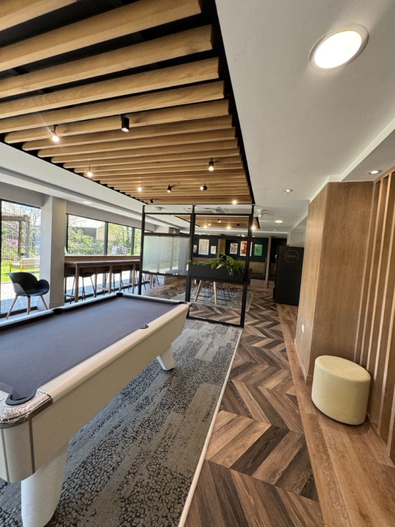 Student chill-out area with pool table and feature ceiling lighting