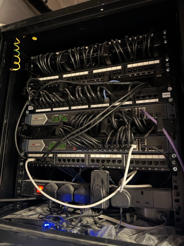 Network rack with Hikvision switches for CCTV and building systems