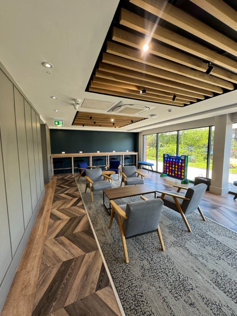 Purpose-built student lounge with seating and bar area