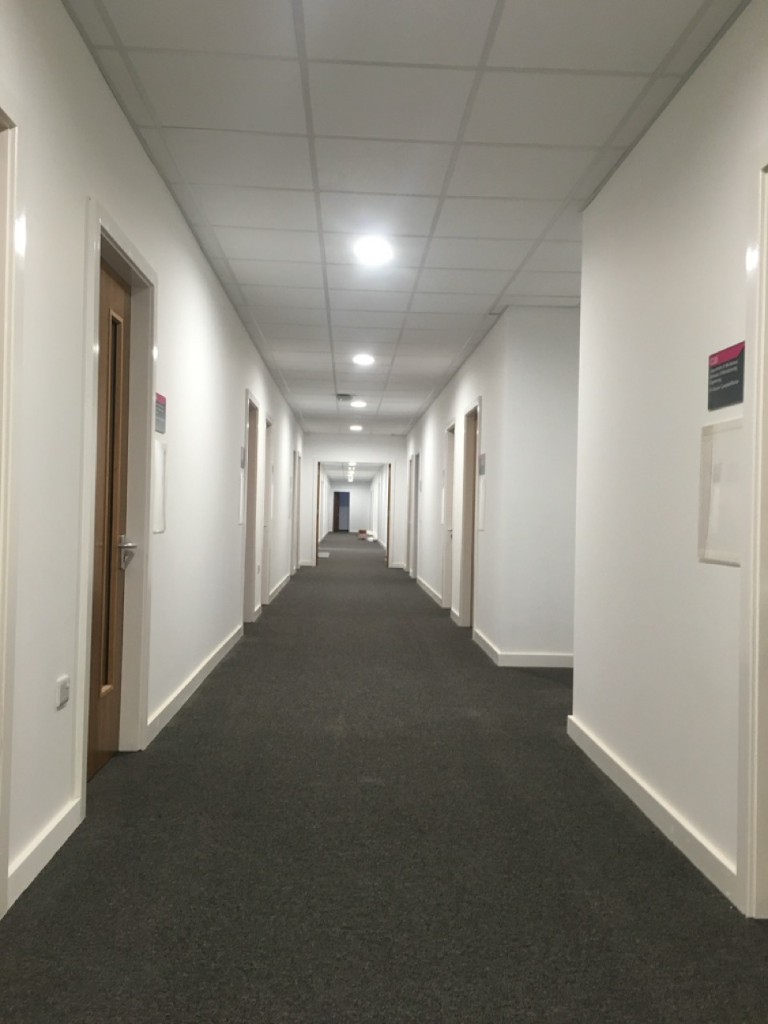 Refurbished corridor with recessed downlights