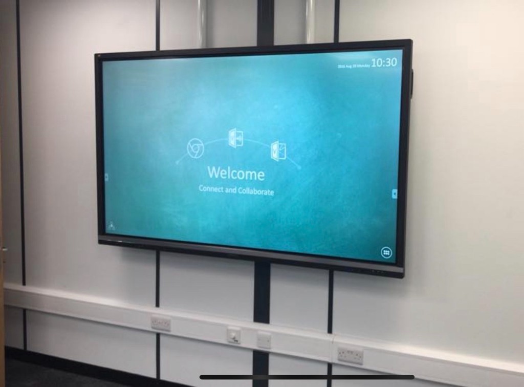 Wall-mounted interactive display with integrated power and data