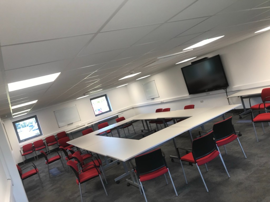 Training room with wall-mounted display and trunking