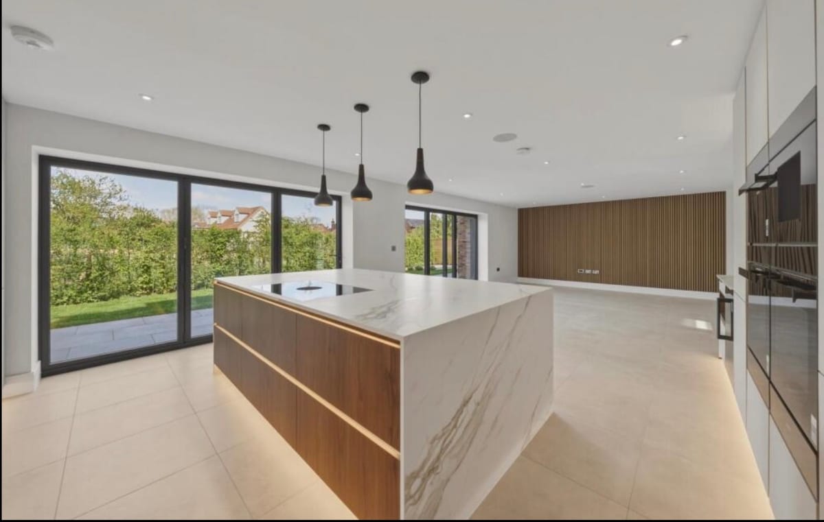 Kitchen with island pendant lights and integrated LED strip lighting