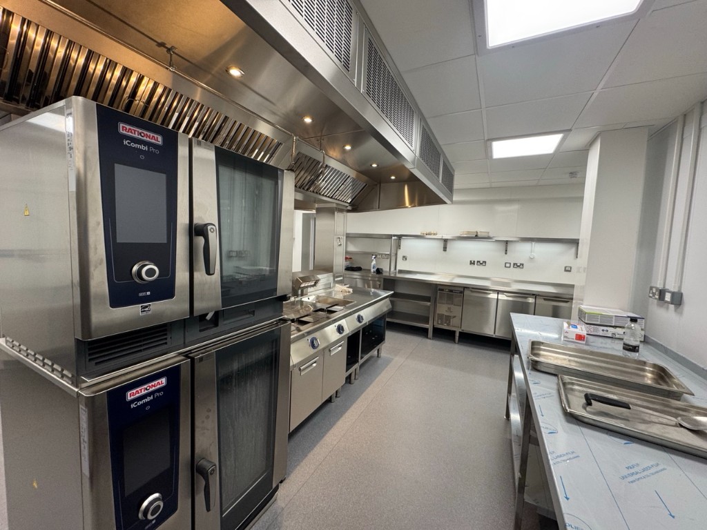 Stainless steel kitchen with Rational ovens and extraction canopy