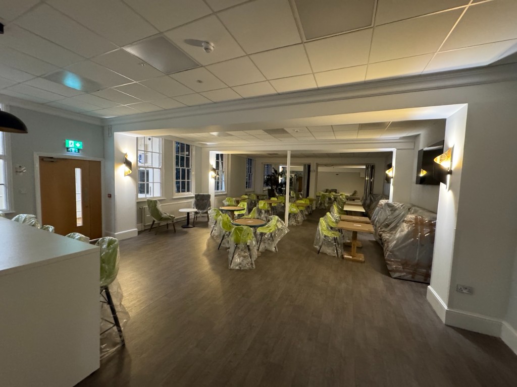 Staff dining hall with new flooring, LED panels, and wall lights