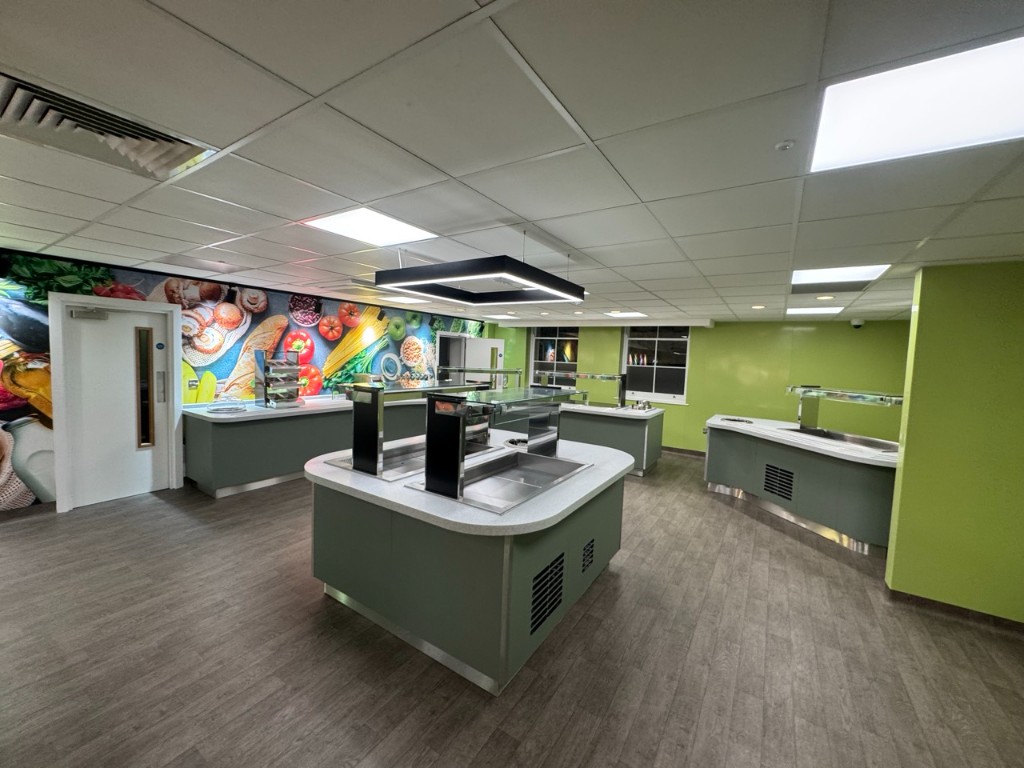 Servery islands with glass screens and pendant lighting