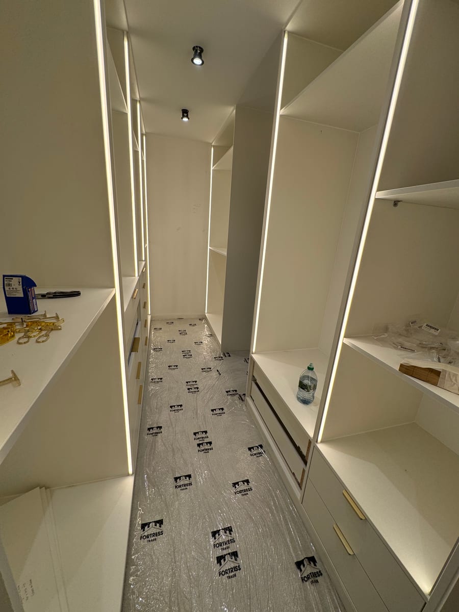 Walk-in wardrobe with integrated LED strip lighting